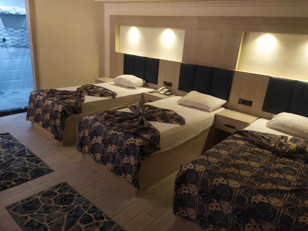 Postel nebo postele na pokoji v ubytování Havana Hotel Cairo