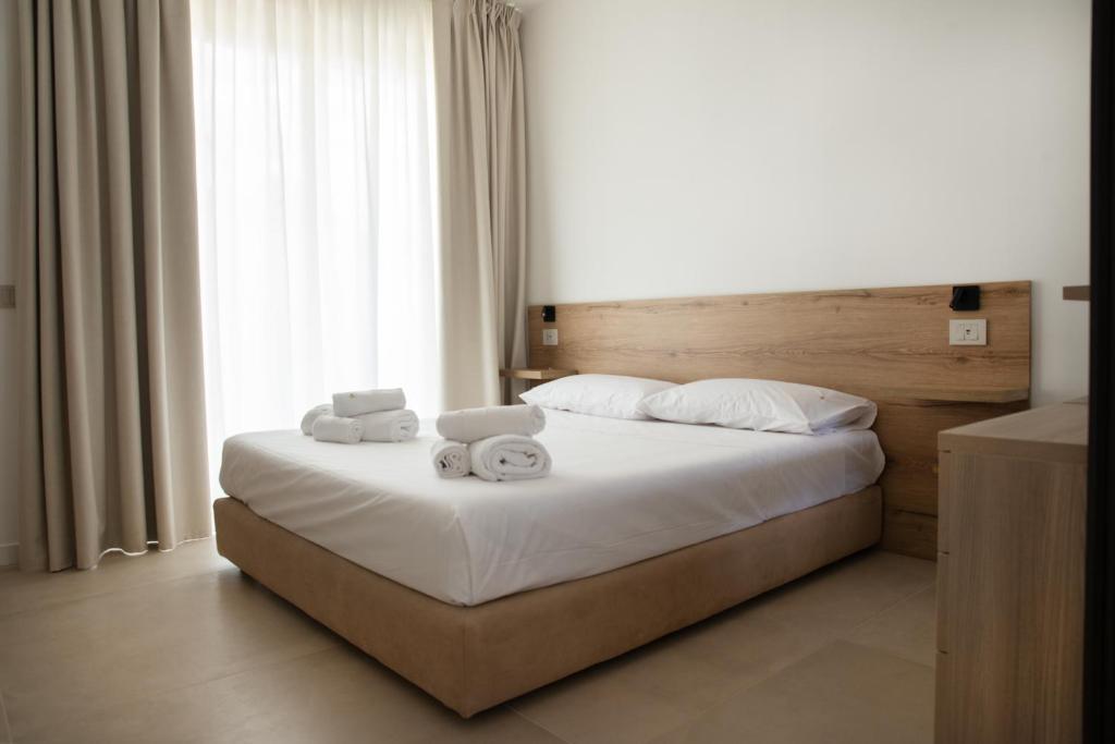 Postel nebo postele na pokoji v ubytování Montedarena Hotel