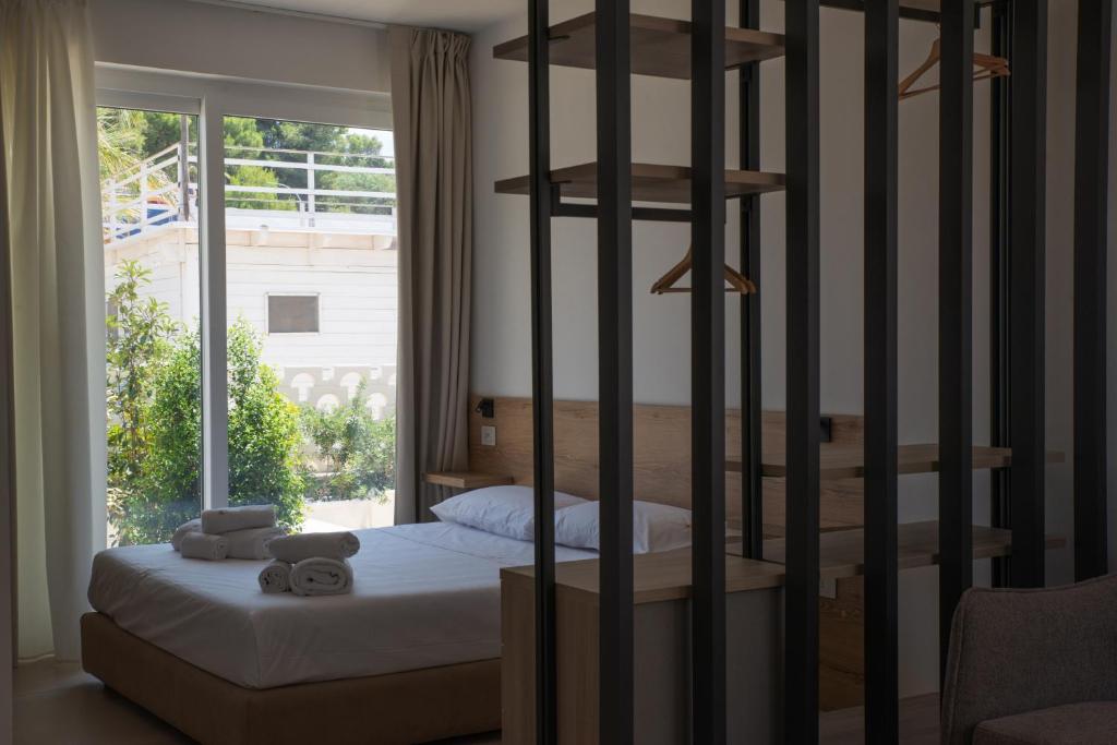 Postel nebo postele na pokoji v ubytování Montedarena Hotel