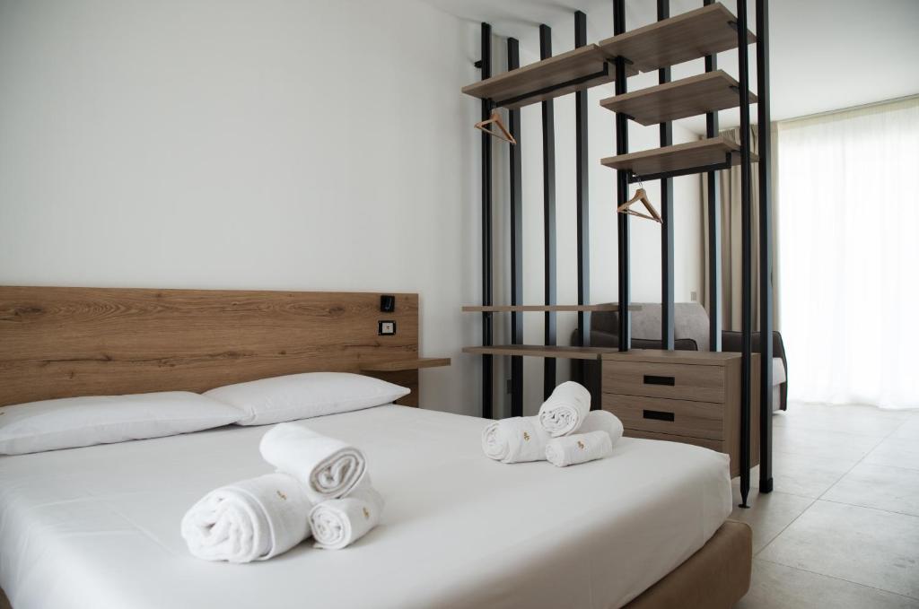 Postel nebo postele na pokoji v ubytování Montedarena Hotel