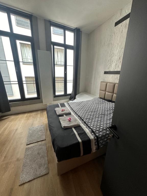 Postel nebo postele na pokoji v ubytování Stay in Antwerp City
