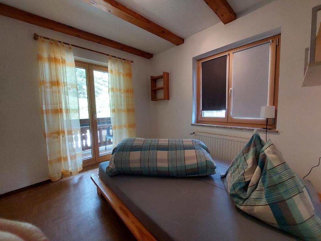 Postel nebo postele na pokoji v ubytování Ferienappartment Hölzl