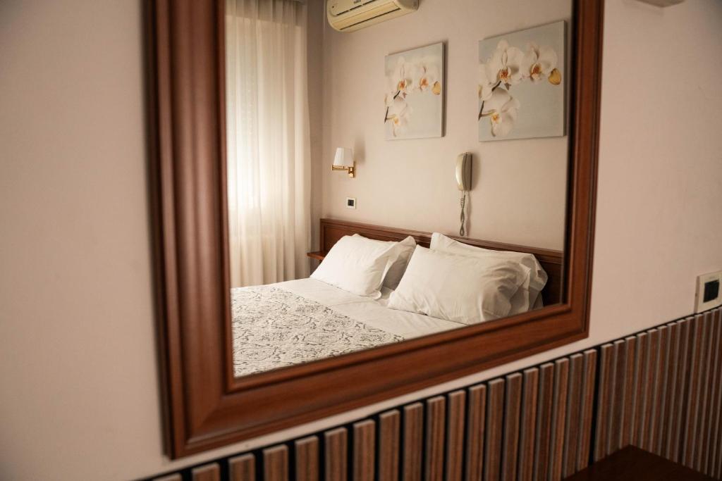 Postel nebo postele na pokoji v ubytování Hotel Marconi
