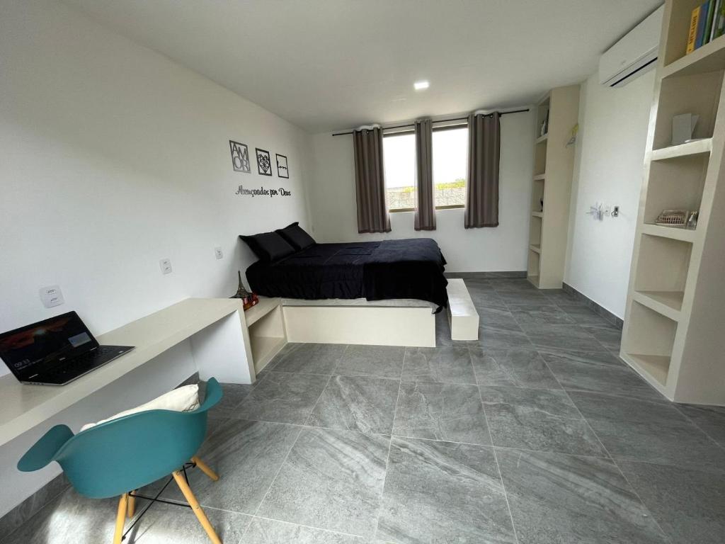 Ένα ή περισσότερα κρεβάτια σε δωμάτιο στο Casa de praia em condomínio fechado, a 5min do mar