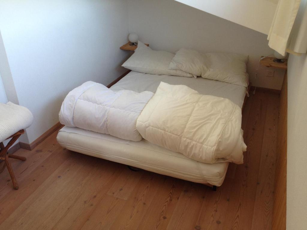 Postel nebo postele na pokoji v ubytování Casa Nolens, Via Sura 4