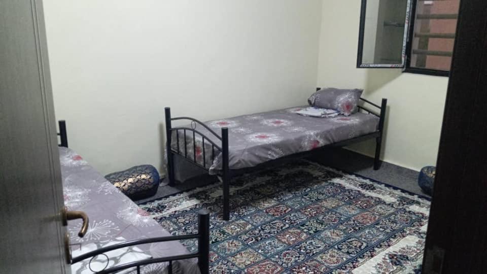 Letto o letti in una camera di Mamy Residence