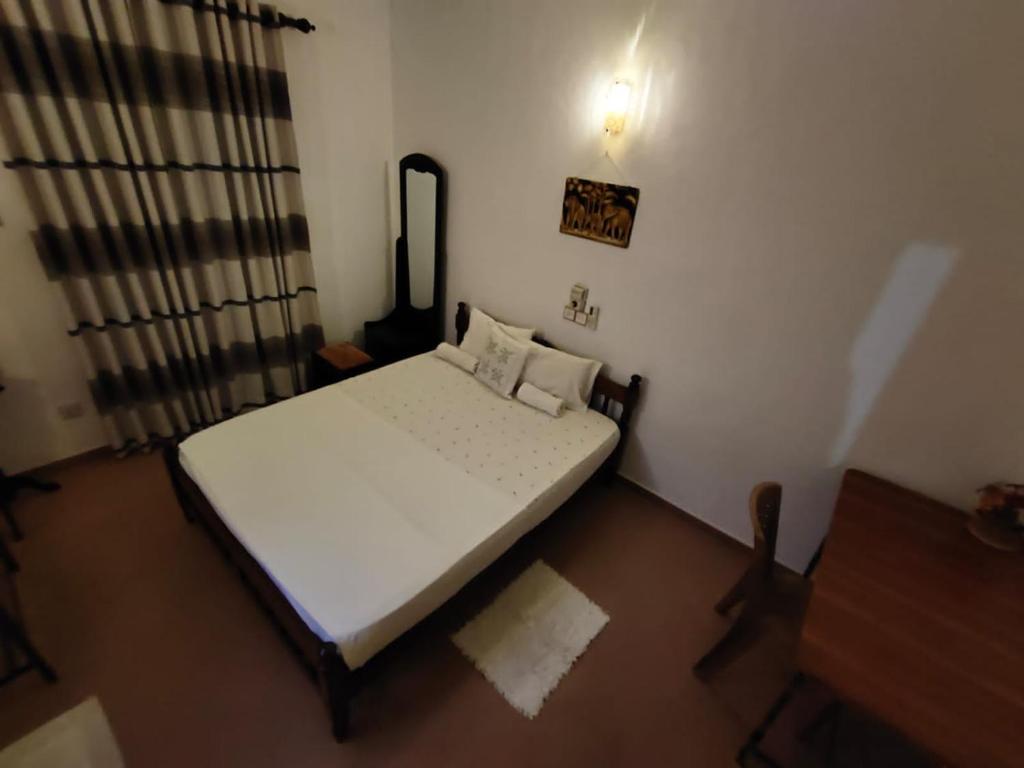 Postel nebo postele na pokoji v ubytování NH Rest House