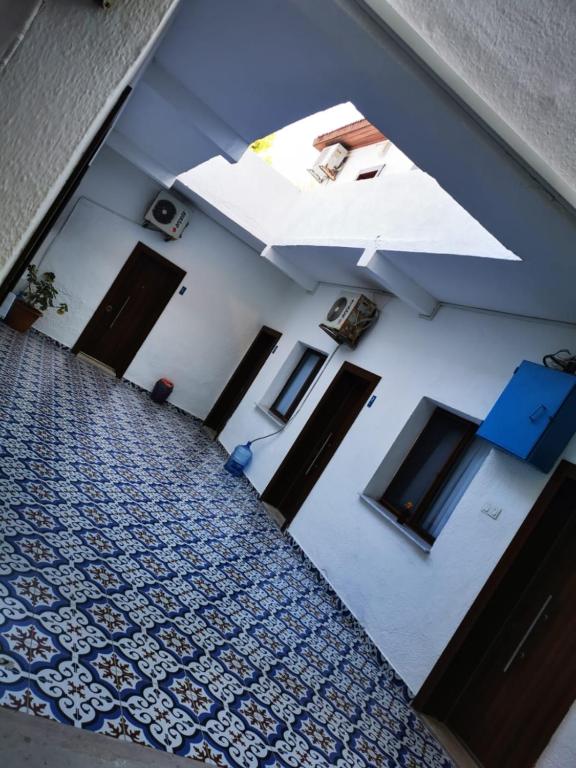 an overhead view of a hallway with an umbrella at Kalipso motel in Çeşme