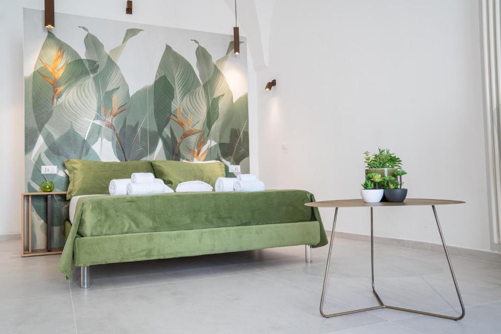 Postel nebo postele na pokoji v ubytování La Bella Ostuni Suites