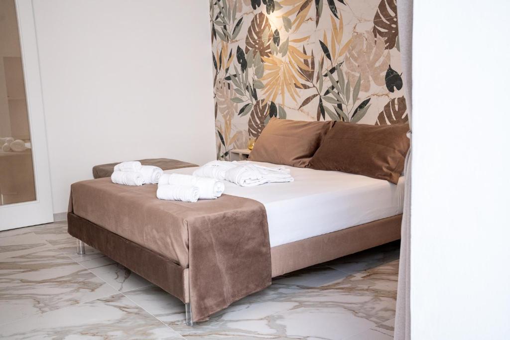 Postel nebo postele na pokoji v ubytování La Bella Ostuni Suites