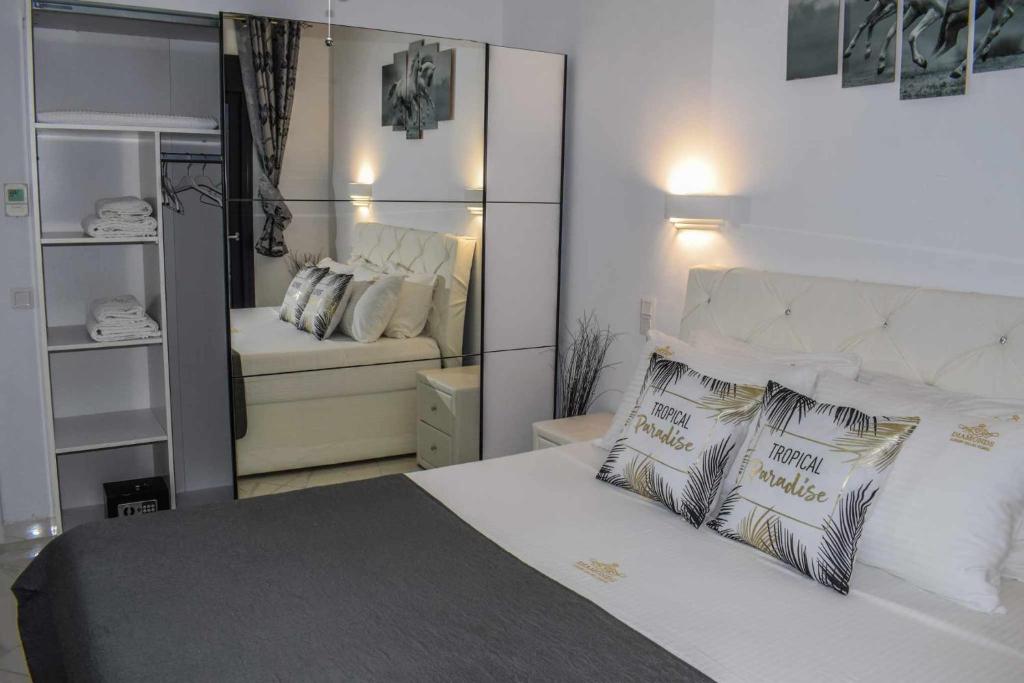 A bed or beds in a room at Diamond Luxury Villa Corfu 6 Bedroom Luxury Villa