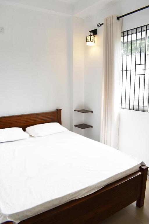 Postel nebo postele na pokoji v ubytování Orchard Home