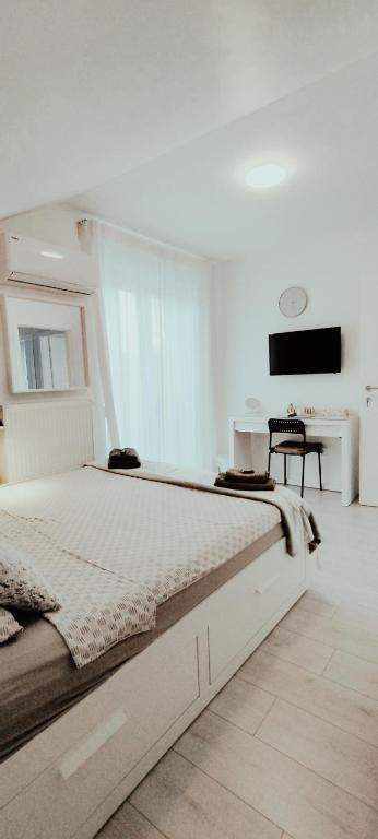 Łóżko lub łóżka w pokoju w obiekcie WHITE ROOMS ARENA ZAGREB
