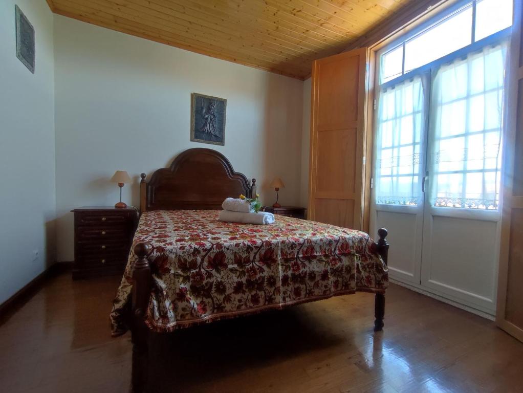 Postel nebo postele na pokoji v ubytování Casa 3 Irmãs