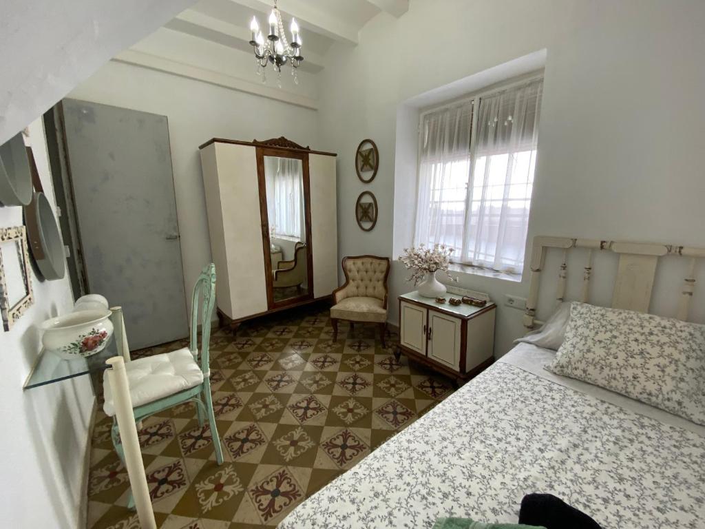 A bed or beds in a room at Tutu llar ús turistic