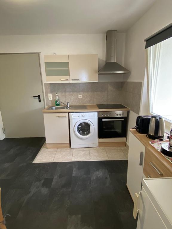 Kuchyň nebo kuchyňský kout v ubytování Marija Apartment