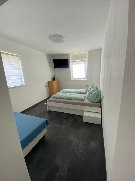 Postel nebo postele na pokoji v ubytování Marija Apartment