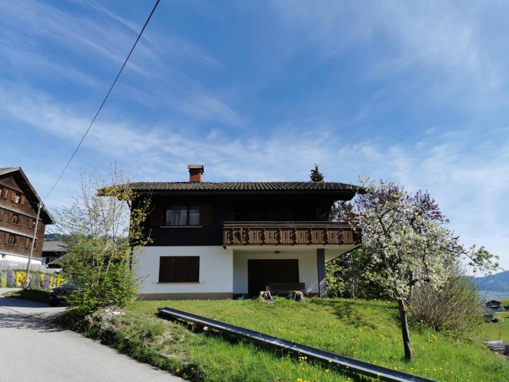 a small house with a roof on the side of it at Ferienhaus Buchen in Schwarzenberg