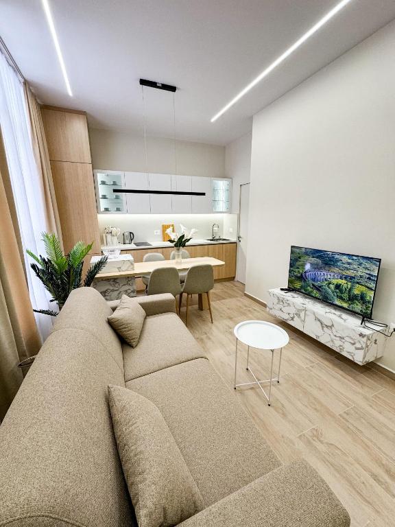 Un televizor și/sau centru de divertisment la Nomad Stay Apartments