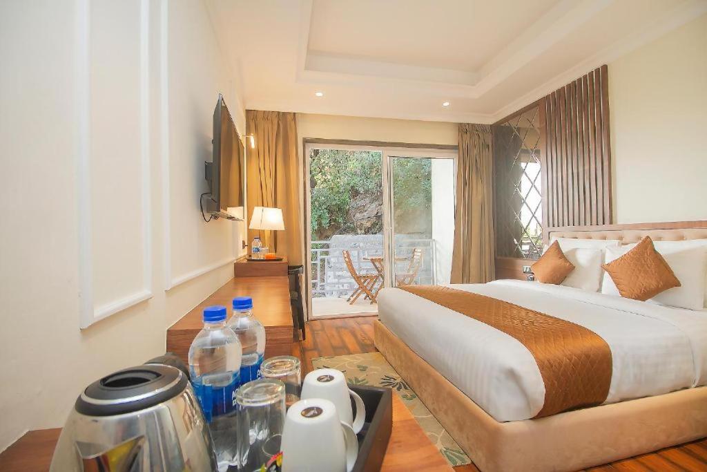 Postel nebo postele na pokoji v ubytování Baris resort Mussoorie