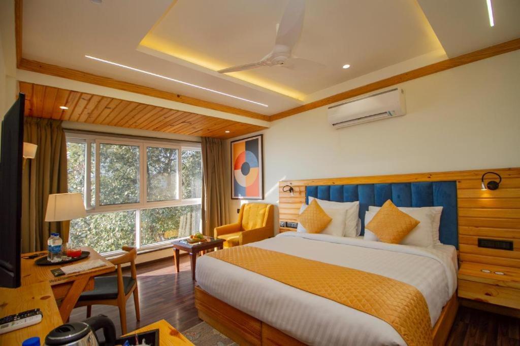 Postel nebo postele na pokoji v ubytování Baris resort Mussoorie