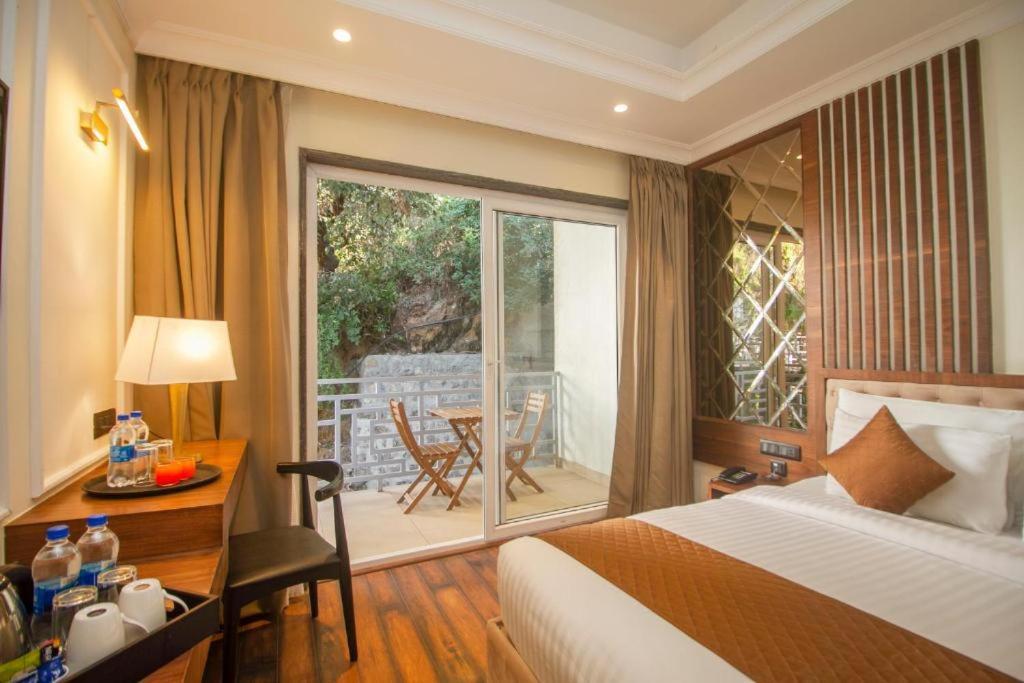 Postel nebo postele na pokoji v ubytování Baris resort Mussoorie