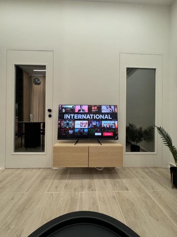 Un televizor și/sau centru de divertisment la Nomad Stay Apartments