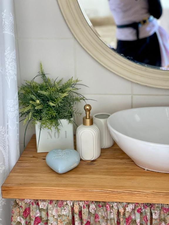 a bathroom counter with a sink and a mirror at Suits יחידת נופש מתוקה באילת in Eilat