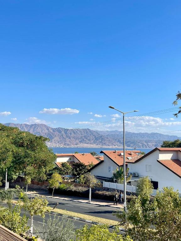 a view of a street with buildings and a street light at Suits יחידת נופש מתוקה באילת in Eilat