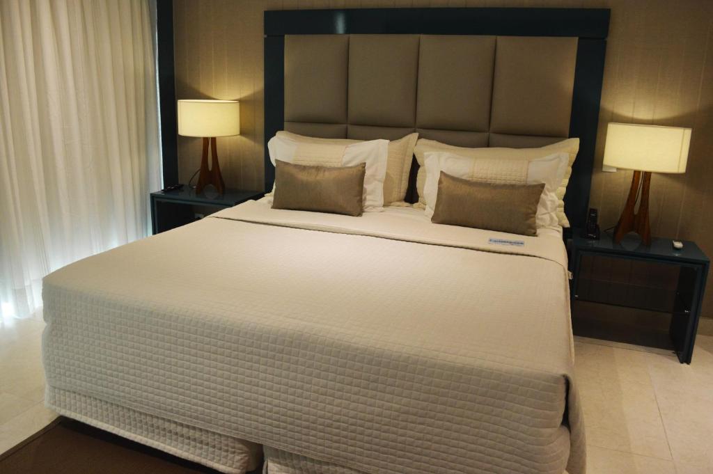 Cama ou camas em um quarto em Nord Luxxor Sapucaia