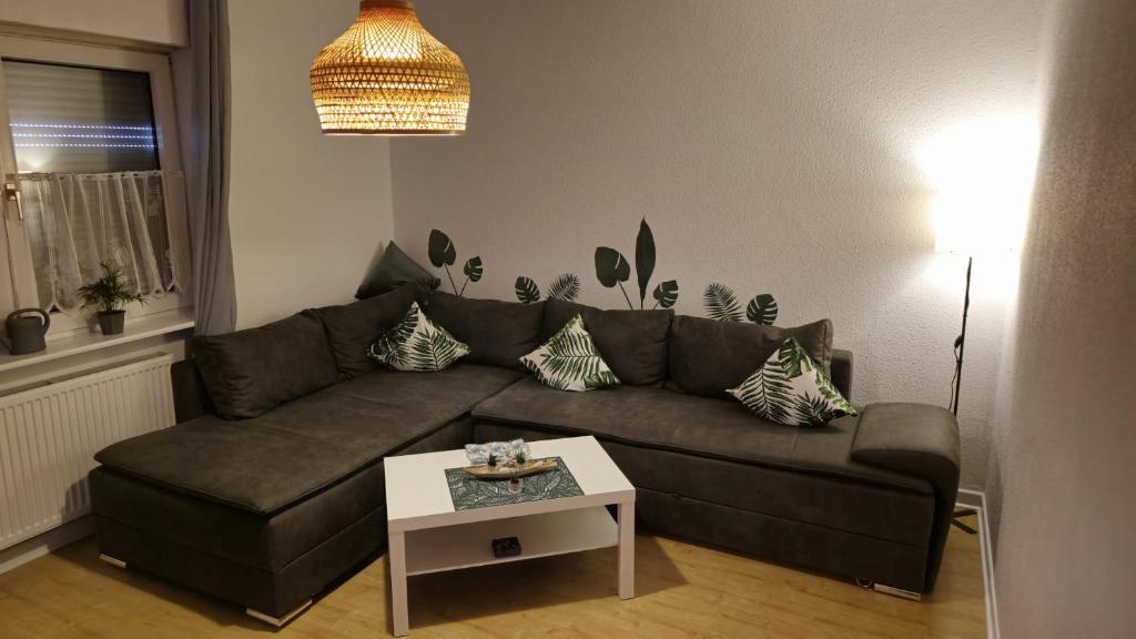 a living room with a couch and a table at Dschungel-Apartment Steubenstr 13 in Kassel