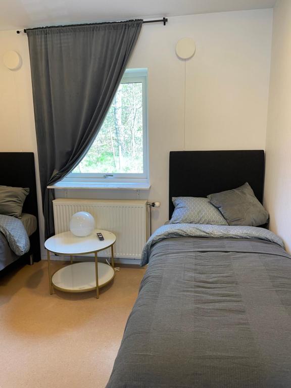 Postel nebo postele na pokoji v ubytování långstorp