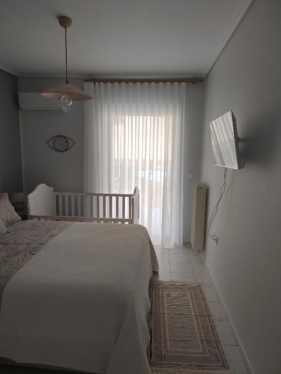 Postel nebo postele na pokoji v ubytování The cozy seaside apartment