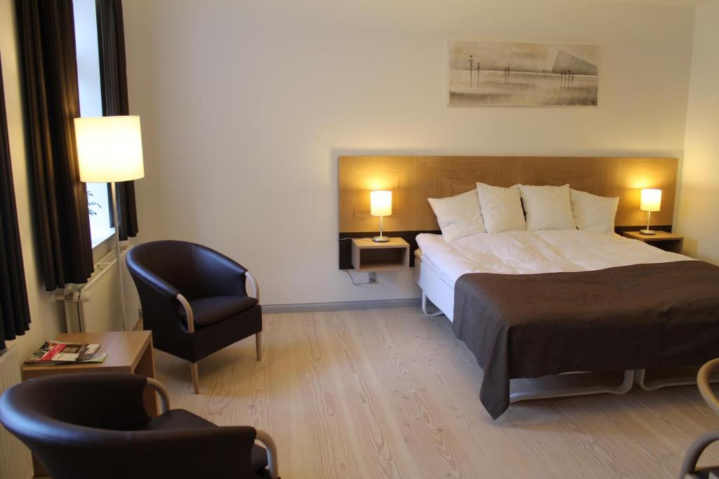 Postel nebo postele na pokoji v ubytování Brødremenighedens Hotel
