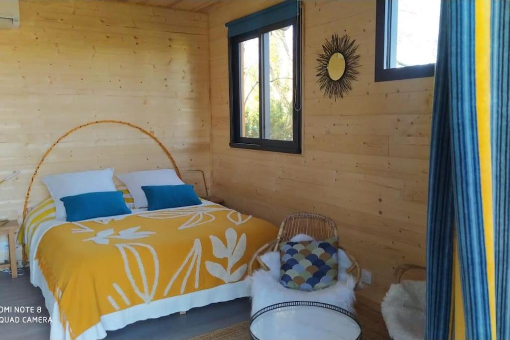 Postel nebo postele na pokoji v ubytování Évasion nature - Tiny house