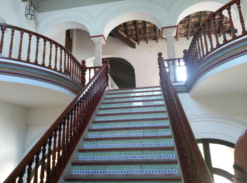a staircase in a building with blue and green steps at Duplex convento la victoria in Sanlúcar de Barrameda