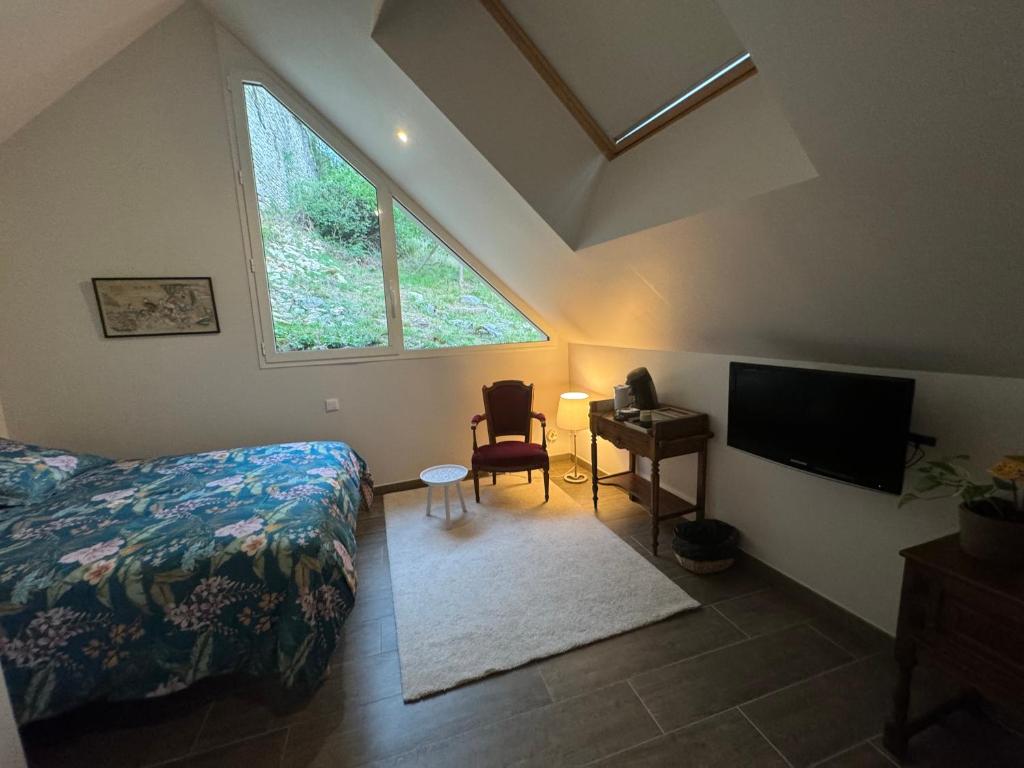 Postel nebo postele na pokoji v ubytování Chambre avec accès jacuzzi
