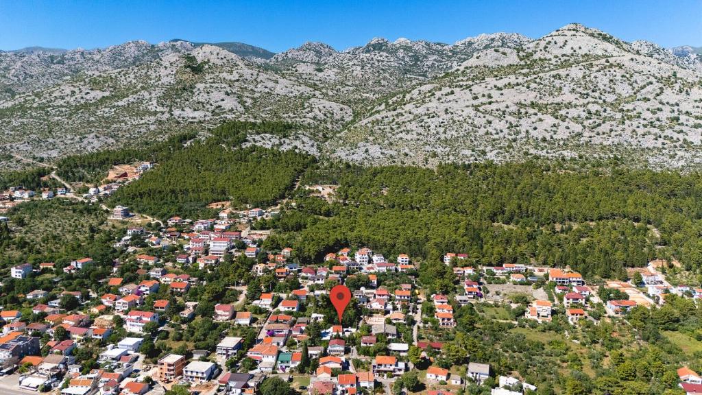 an aerial view of a town in front of mountains at Apartment Tom in Starigrad-Paklenica