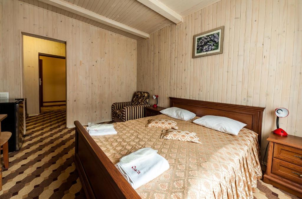 Postel nebo postele na pokoji v ubytování Olga Hotel SPA