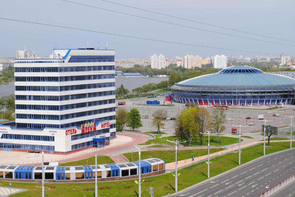 
a large building with a lot of windows on top of it at Arena Hotel in Minsk
