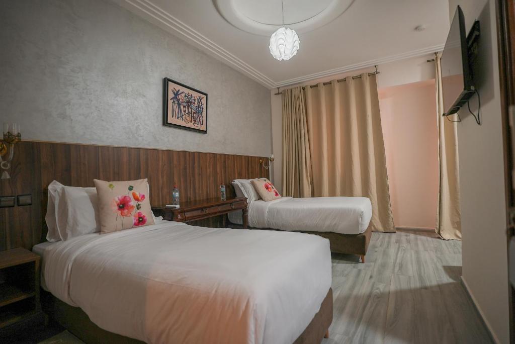 Postel nebo postele na pokoji v ubytování Hotel Arabesque