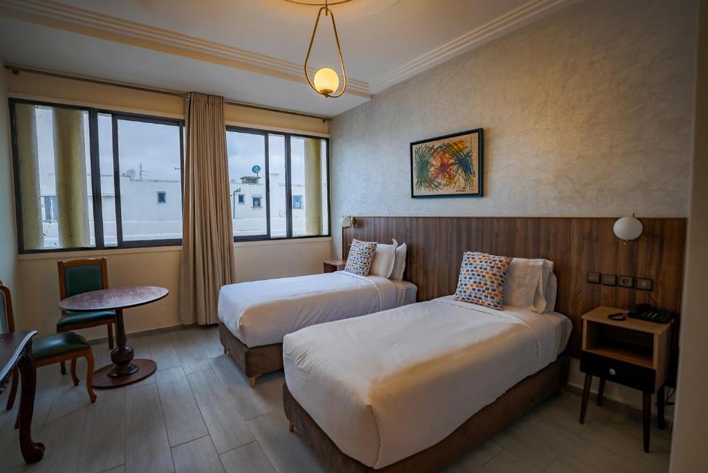 Postel nebo postele na pokoji v ubytování Hotel Arabesque