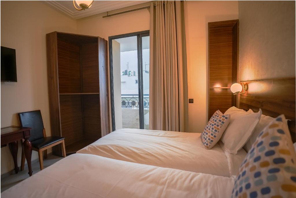 Postel nebo postele na pokoji v ubytování Hotel Arabesque