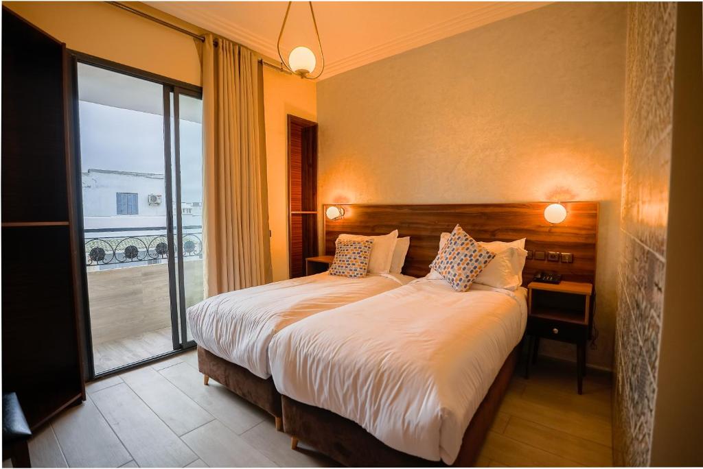 Postel nebo postele na pokoji v ubytování Hotel Arabesque