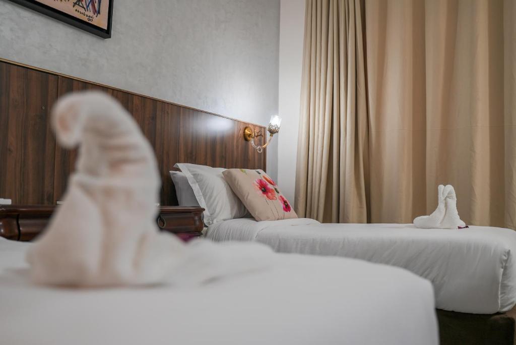 Postel nebo postele na pokoji v ubytování Hotel Arabesque