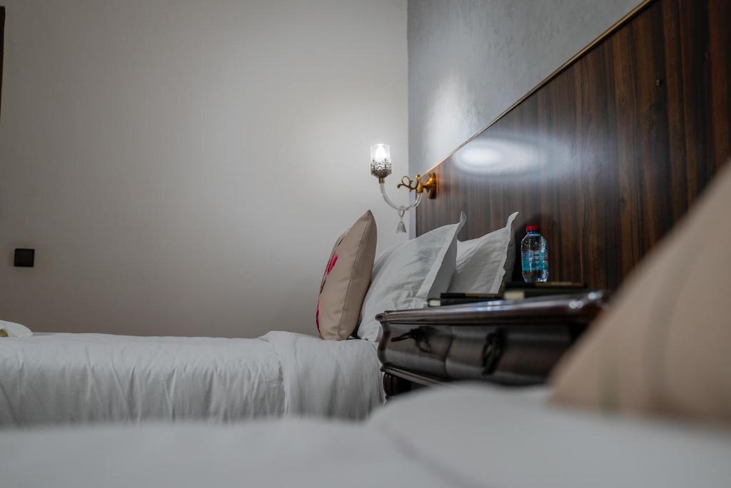 Postel nebo postele na pokoji v ubytování Hotel Arabesque