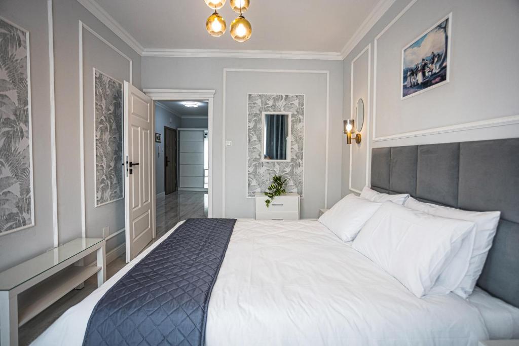 Postel nebo postele na pokoji v ubytování Deluxe Apartment