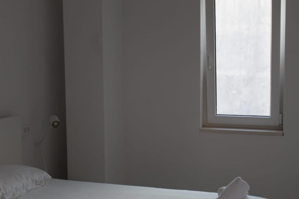Posteľ alebo postele v izbe v ubytovaní Red Wine Apartments