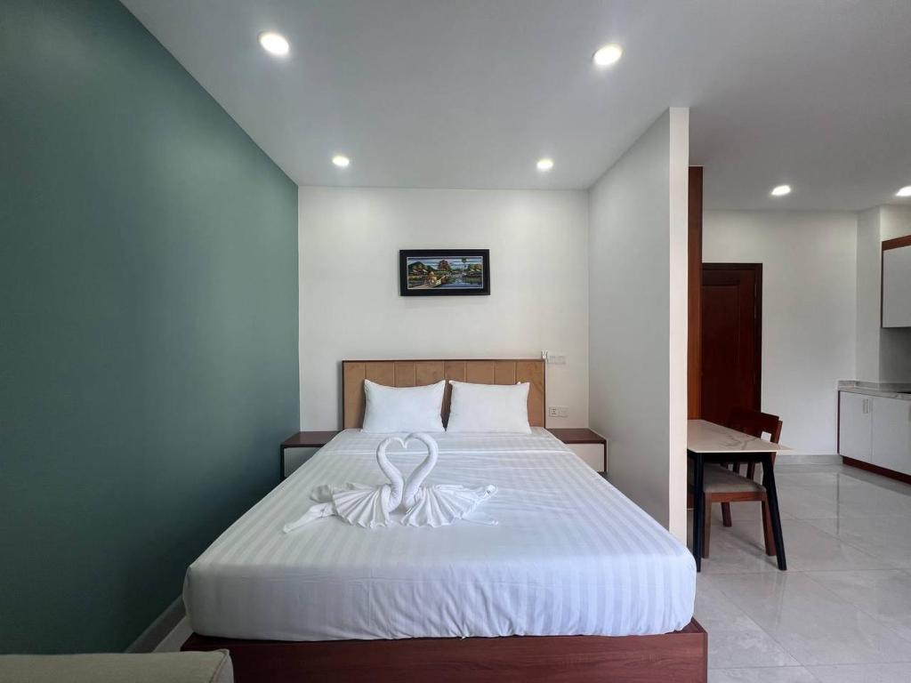 Postel nebo postele na pokoji v ubytování C-Hotel