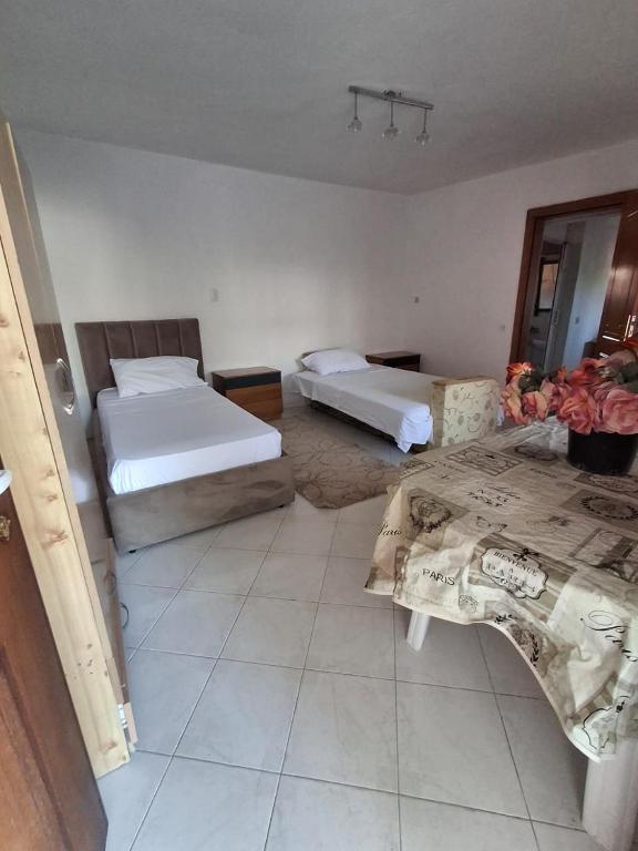 Postel nebo postele na pokoji v ubytování Aleko Guest House